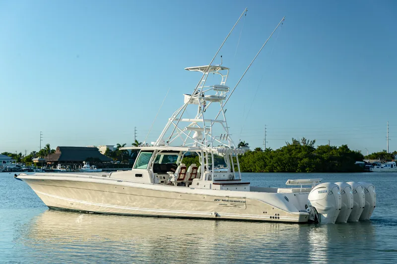 Slide: The Image of 2018 HCB 53 Suenos RXV boat with multiple outboard engines on calm water. - 7