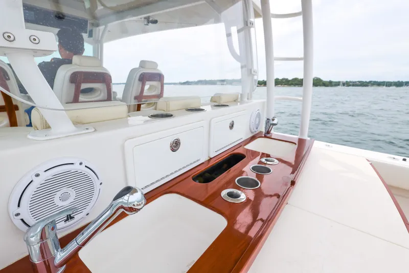 Slide: The Image of 2018 HCB 53 Suenos boat interior with sink and seating, overlooking the water. - 24
