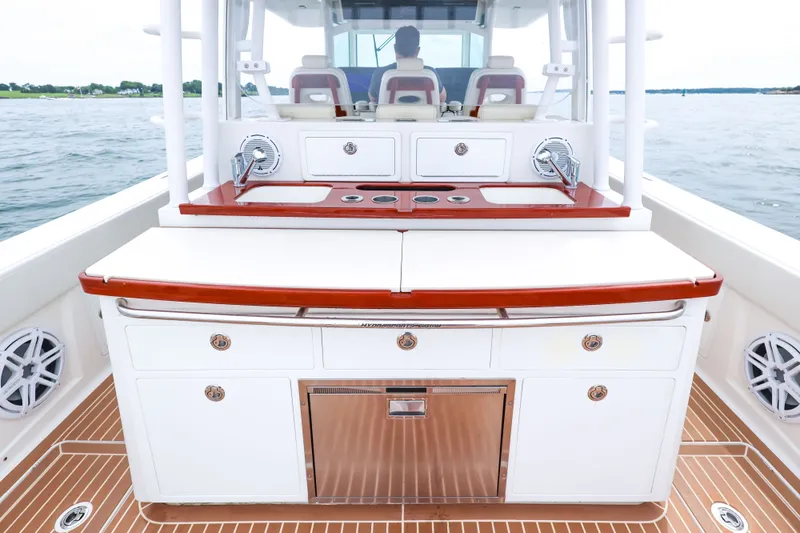 Slide: The Image of 2018 HCB 53 Suenos boat interior with sleek cabinetry and modern amenities on open water. - 22