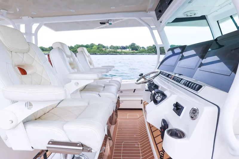 Slide: The Image of Luxurious interior of 2018 HCB 53 Suenos boat with plush seating and advanced controls. - 32