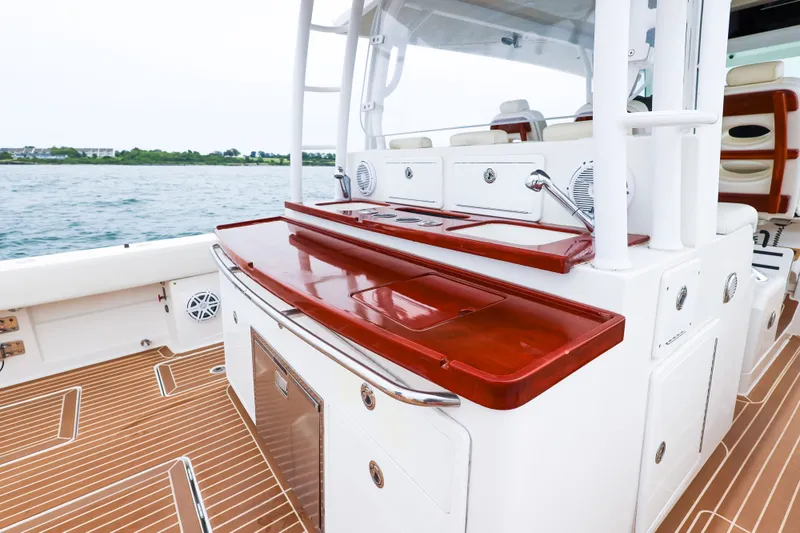 Slide: The Image of 2018 HCB 53 Suenos boat interior with sleek wooden countertops and modern amenities. - 23