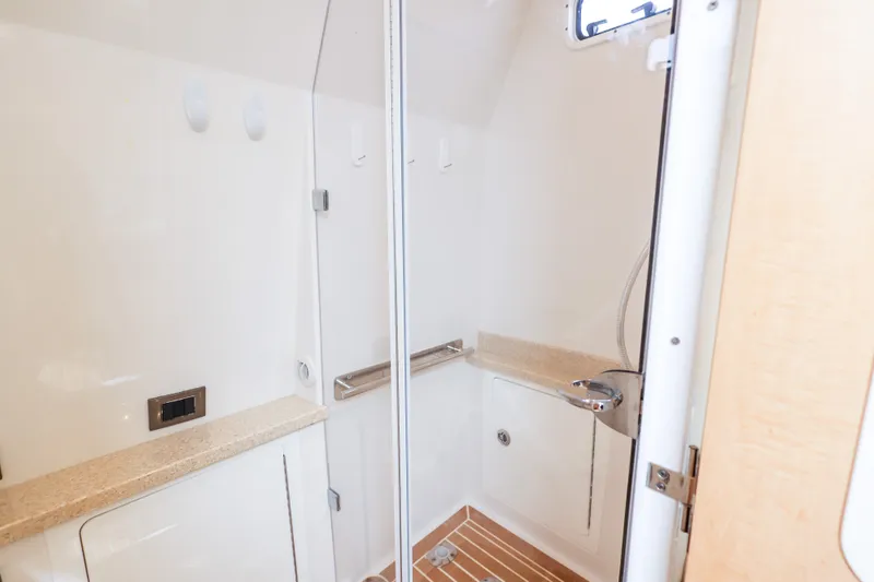 Slide: The Image of 2018 HCB 53 Suenos boat interior shower with sleek design and modern fixtures. - 44