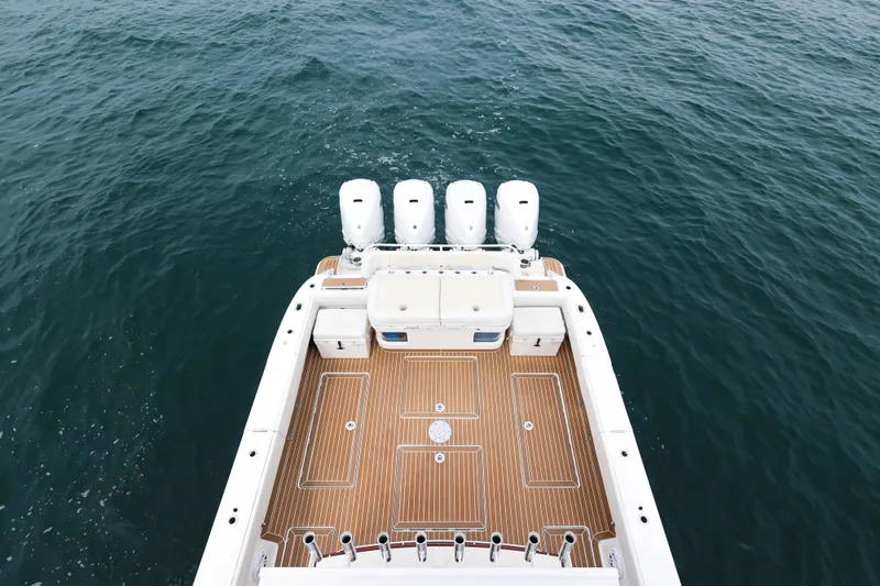 Slide: The Image of 2018 HCB 53 Suenos boat with four engines on open water. - 14