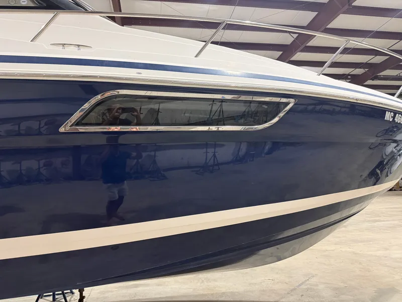 Slide: The Image of The 2018 Regal 35 Sport Coupe features a sleek blue hull with stylish windows. - 9