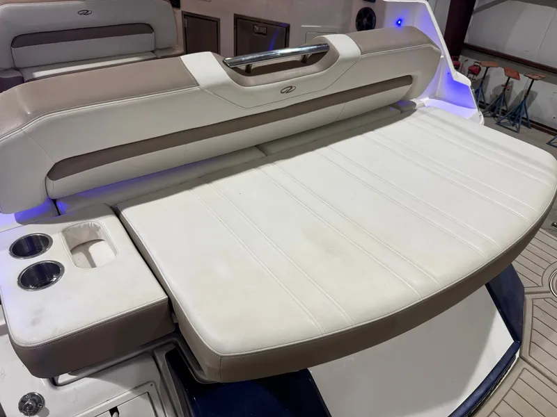 Slide: The Image of The 2018 Regal 35 Sport Coupe features a spacious, cushioned sunpad with built-in cup holders. - 21