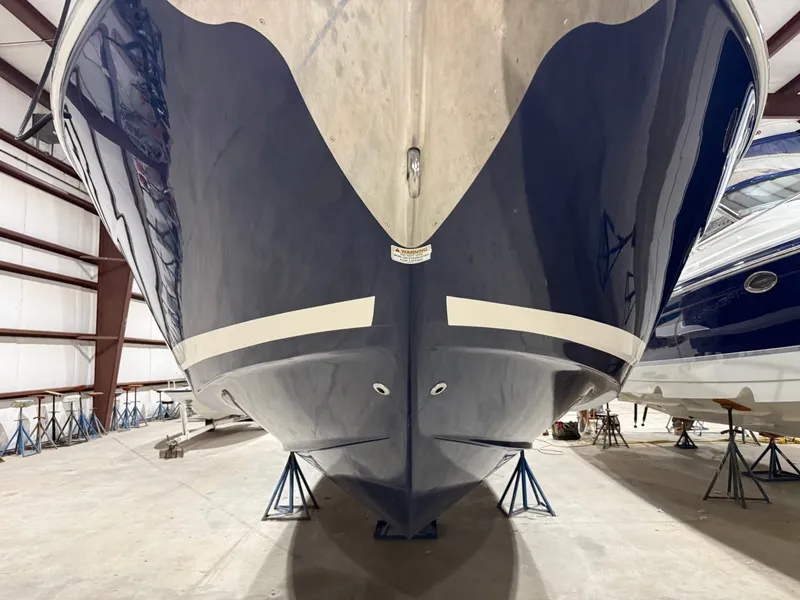 Slide: The Image of The 2018 Regal 35 Sport Coupe is supported on stands in a storage facility. - 13