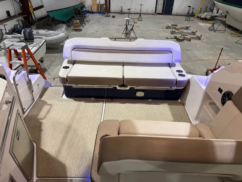 Slide: The Image of The image shows the cockpit of a 2018 Regal 35 Sport Coupe with beige seating. - 23