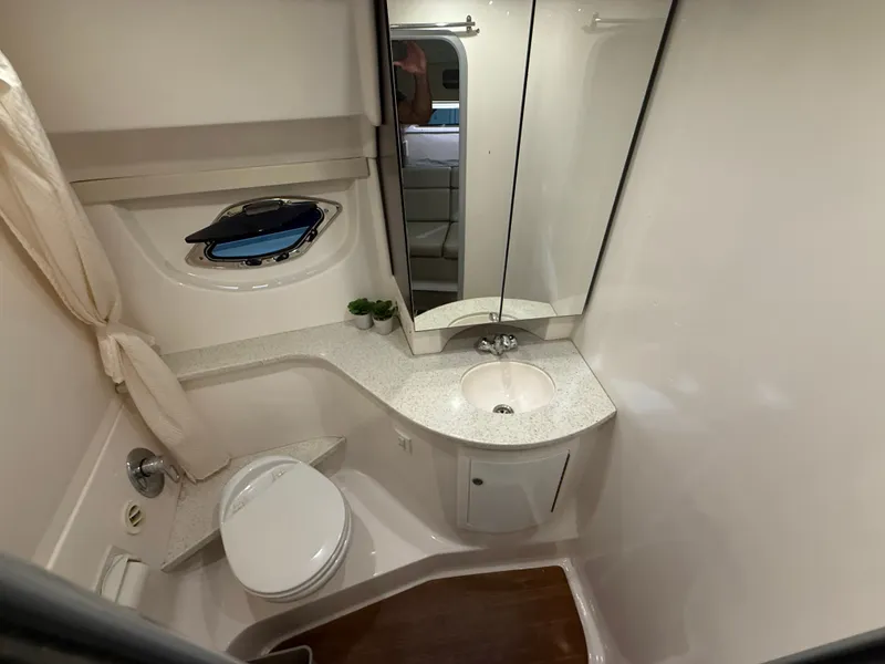 Slide: The Image of The image shows an elegant yacht bathroom with a sink, toilet, and mirror. - 47