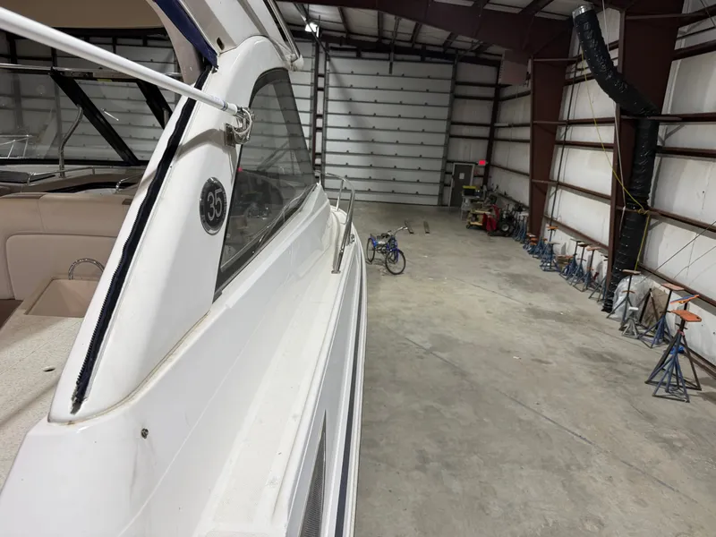 Slide: The Image of A 2018 Regal 35 Sport Coupe is situated in a large warehouse. - 32