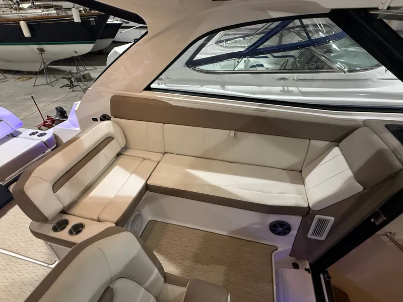 Slide: The Image of Interior of a 2018 Regal 35 Sport Coupe with beige upholstery and sleek design. - 30
