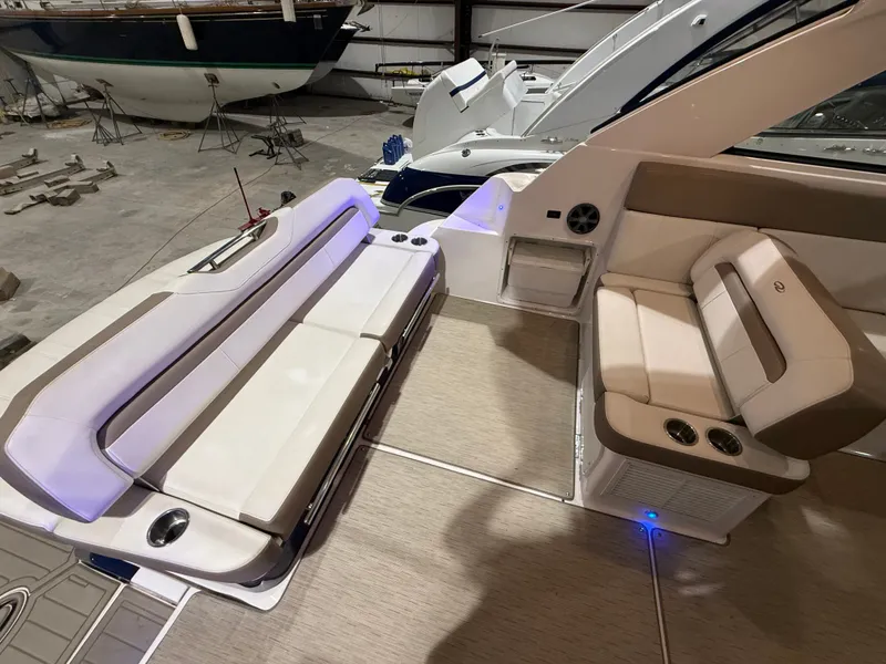 Slide: The Image of The image shows the cockpit of a 2018 Regal 35 Sport Coupe with beige upholstery. - 28