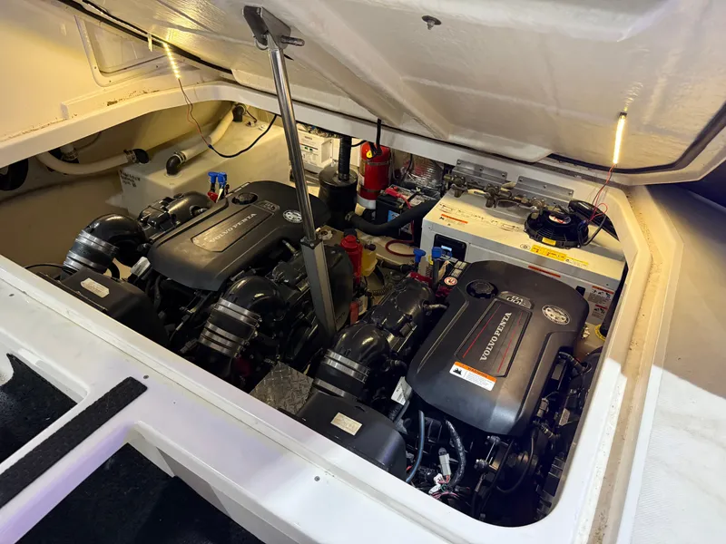 Slide: The Image of The engine compartment of a 2018 Regal 35 Sport Coupe with two powerful engines and batteries. - 49