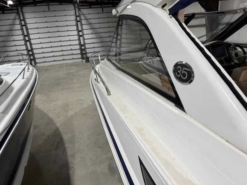 Slide: The Image of The 2018 Regal 35 Sport Coupe is in a warehouse. It features a sleek, modern design. - 33