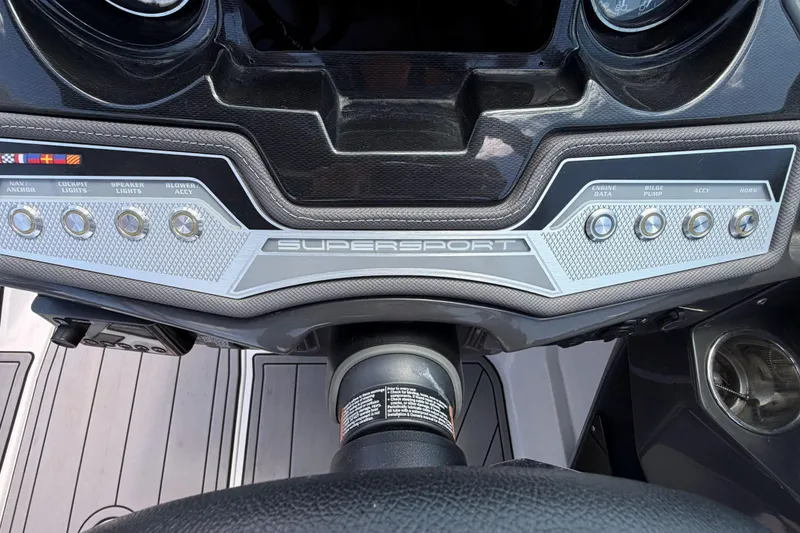Slide: The Image of Dashboard of 2023 Monterey 238SS Super Sport boat with control buttons and steering wheel. - 35