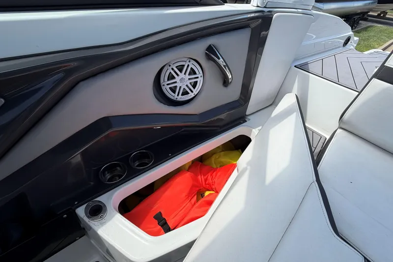 Slide: The Image of 2023 Monterey 238SS Super Sport boat interior with storage compartment and speaker. - 31
