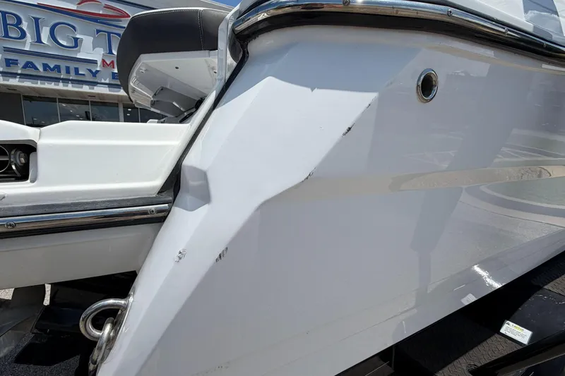 Slide: The Image of 2023 Monterey 238SS Super Sport boat exterior with minor scratches, displayed at dealership. - 8