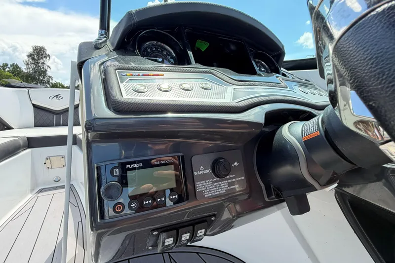 Slide: The Image of Dashboard of 2023 Monterey 238SS Super Sport boat with control panel and steering wheel. - 32