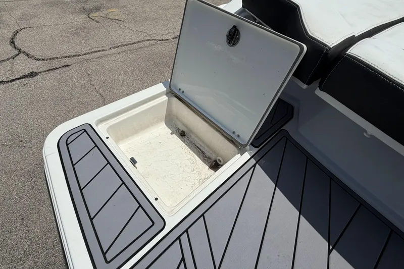 Slide: The Image of Open storage compartment on 2023 Monterey 238SS Super Sport boat deck. - 14