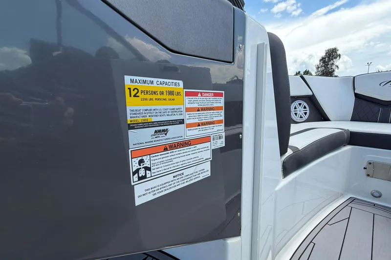 Slide: The Image of 2023 Monterey 238SS Super Sport boat capacity label, seating, and safety warnings. - 36