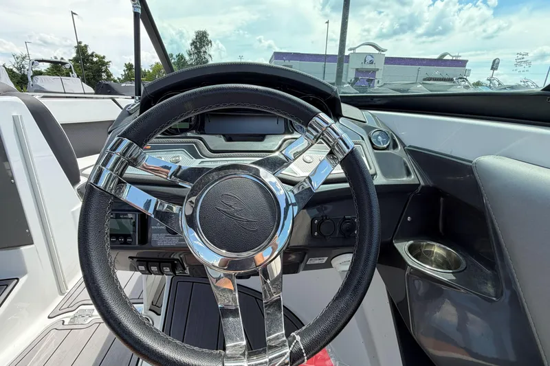 Slide: The Image of Steering wheel of 2023 Monterey 238SS Super Sport boat, showcasing modern dashboard design. - 33