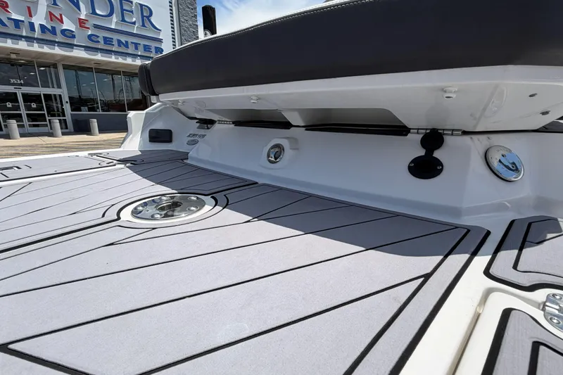 Slide: The Image of 2023 Monterey 238SS Super Sport boat deck at a marine center. - 13