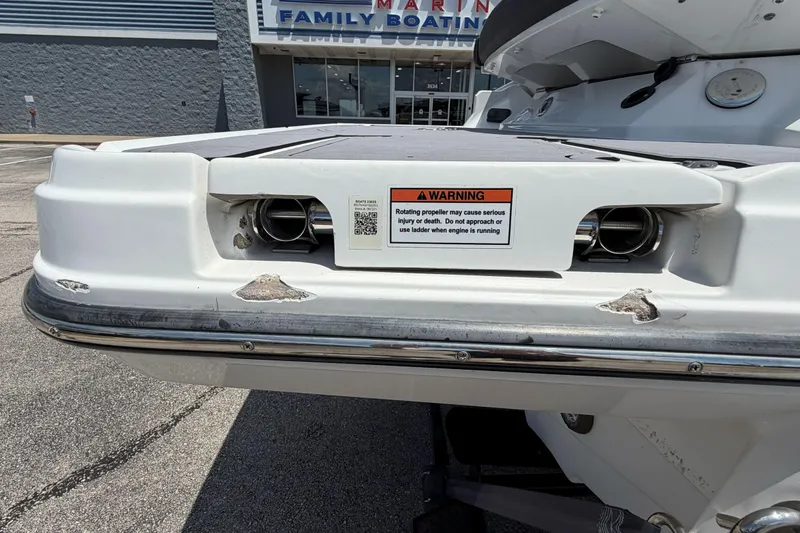 Slide: The Image of 2023 Monterey 238SS Super Sport boat stern with safety warning label. - 10