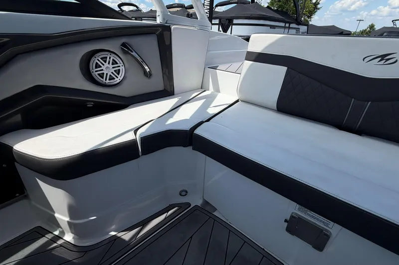 Slide: The Image of Interior of 2023 Monterey 238SS Super Sport boat with cushioned seating and speaker. - 22