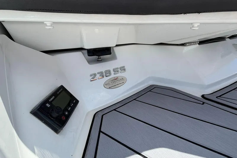Slide: The Image of 2023 Monterey 238SS Super Sport boat deck with control panel and branding. - 15