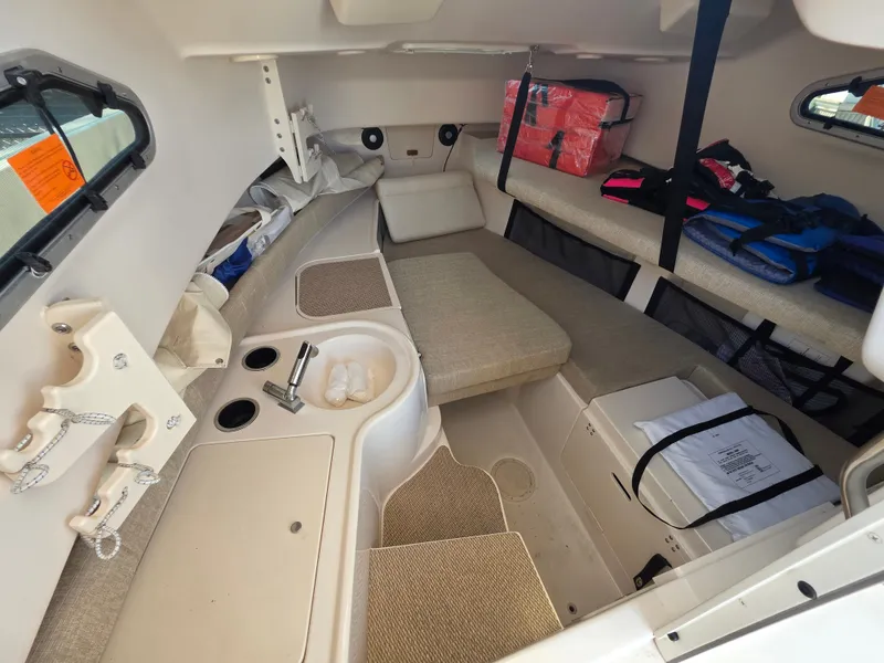 Slide: The Image of Interior of a 2022 Grady-White Gulfstream 232 with seating and storage areas. - 18