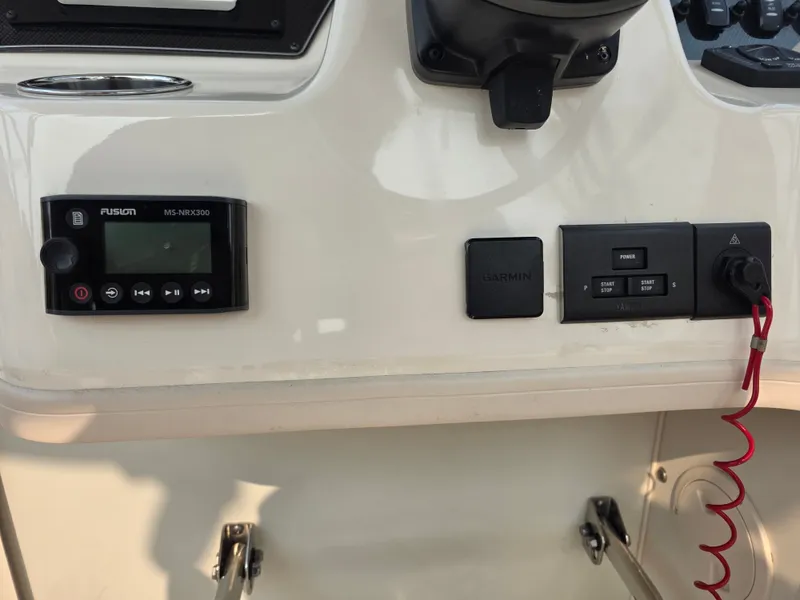 Slide: The Image of The image shows the dashboard of a Grady-White Gulfstream 232 boat with modern controls. - 11