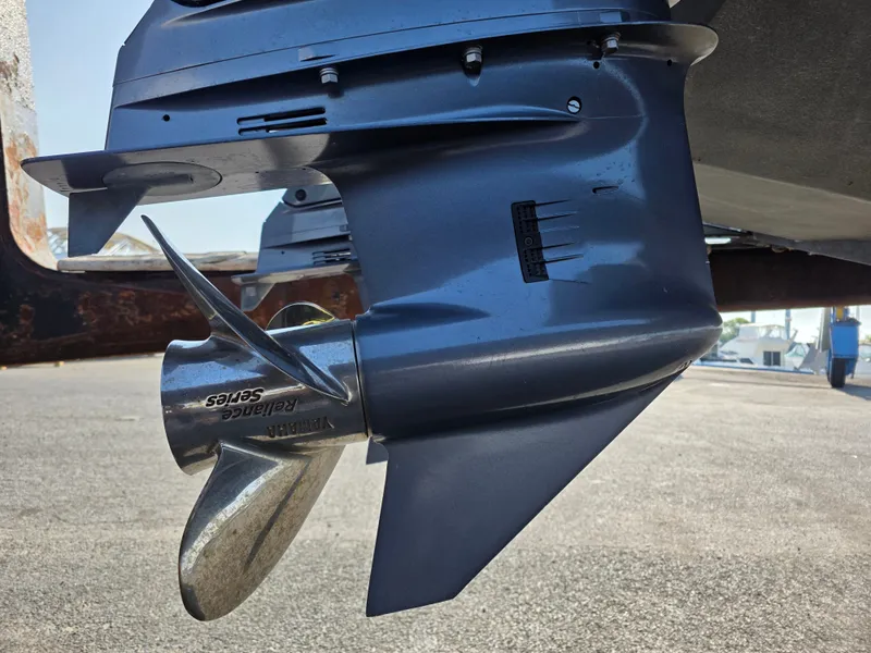 Slide: The Image of Close-up of an outboard motor with propeller, mounted on a boat. - 28