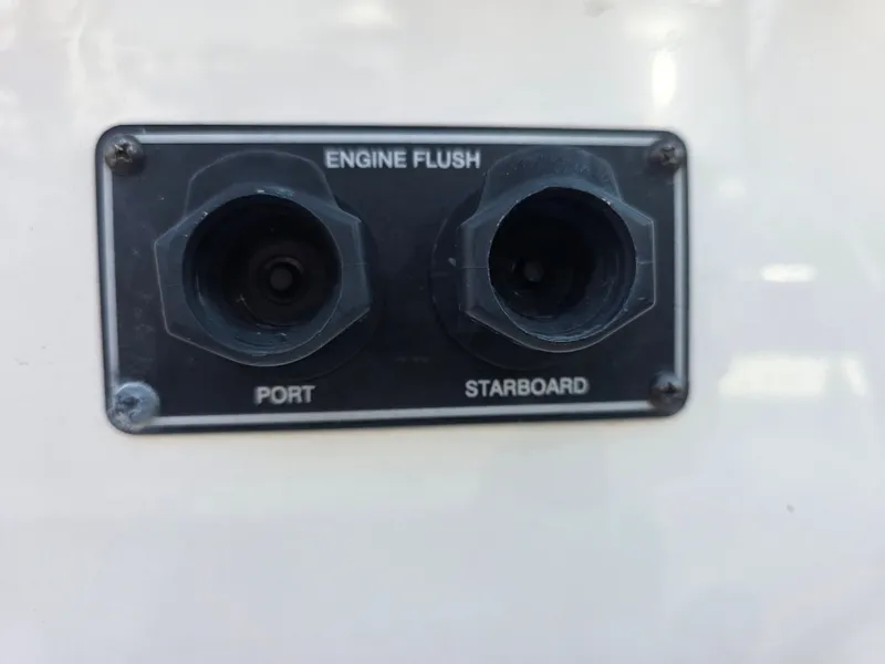 Slide: The Image of Close-up of engine flush ports labeled 'Port' and 'Starboard' on a Grady-White Gulfstream 232 boat. - 23