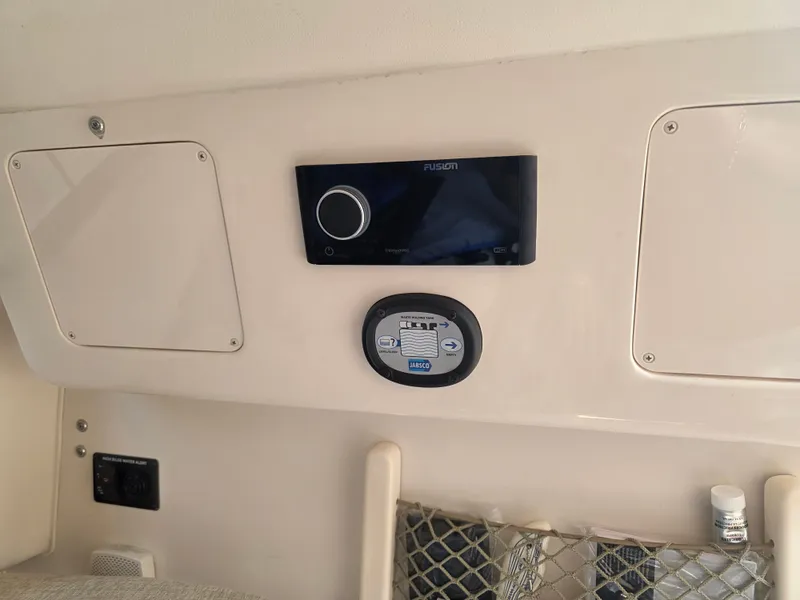 Slide: The Image of The image shows the dashboard of a Grady-White Gulfstream 232 boat with modern controls. - 19