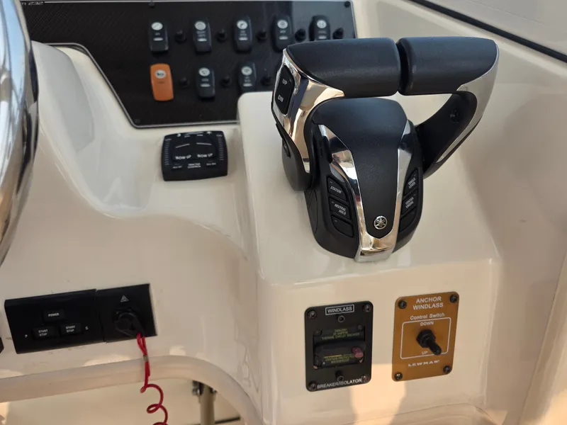 Slide: The Image of Close-up of a Grady-White Gulfstream 232 boat helm with modern controls. - 10