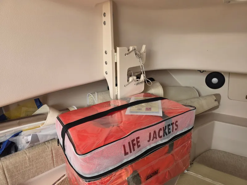 Slide: The Image of A red package labeled "LIFE JACKETS" is placed inside a boat cabin. - 20