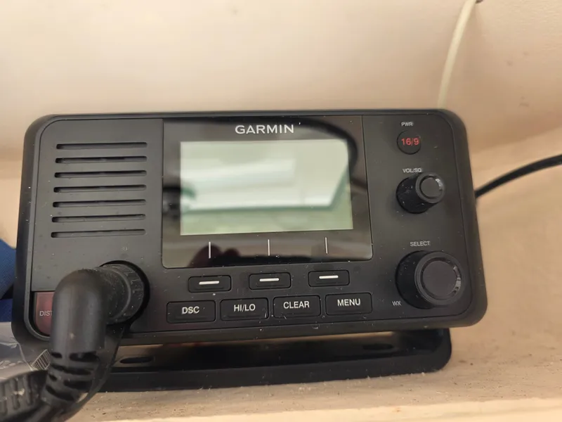 Slide: The Image of A Garmin radio is installed in a boat, featuring various controls and a display. - 16