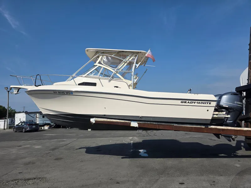 Slide: The Image of A 2022 Grady-White Gulfstream 232 boat on a trailer, ready for use. - 4