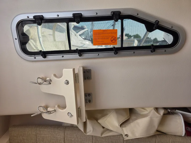 Slide: The Image of Interior view of a Grady-White Gulfstream 232 with a window and wall-mounted holder. - 20