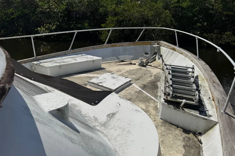 Slide: The Image of Bow of 1981 Broward 72 Motor Yacht with railing and equipment. - 5