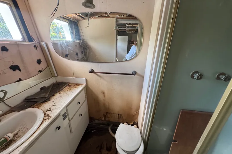 Slide: The Image of Bathroom of 1981 Broward 72 Motor Yacht, showing wear and disrepair. - 38