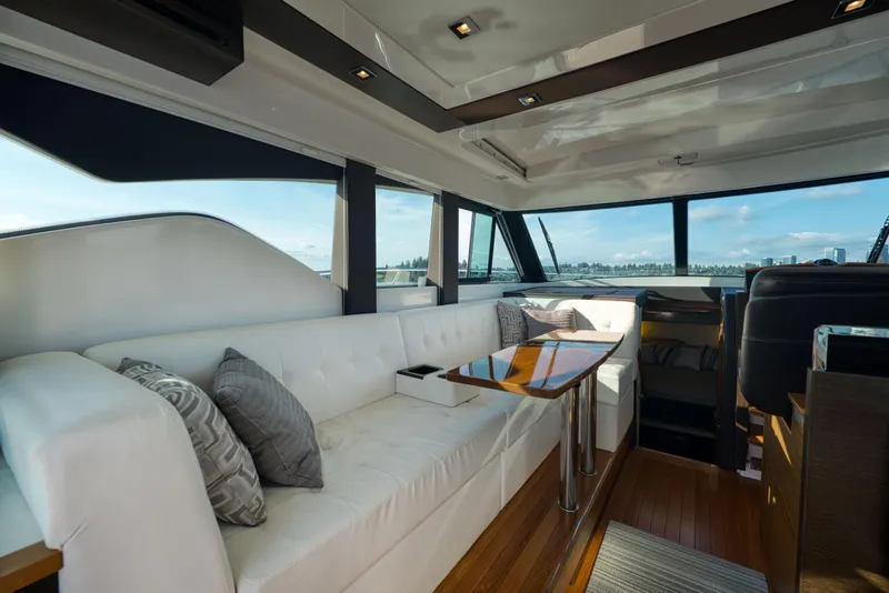 Slide: The Image of Luxurious interior of 2017 Tiara Yachts C39 Coupe with elegant seating and panoramic windows. - 14