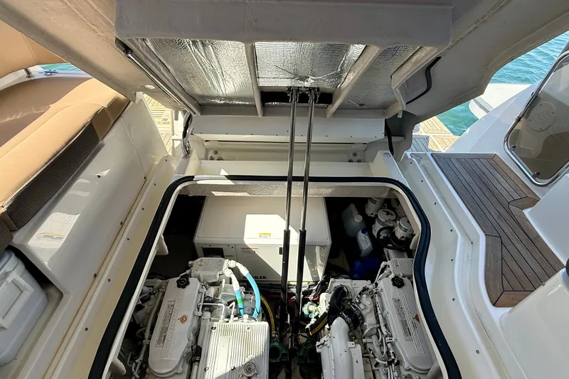 Slide: The Image of Engine compartment of a 2016 Sea Ray Sundancer 400 yacht, showcasing mechanical components. - 65