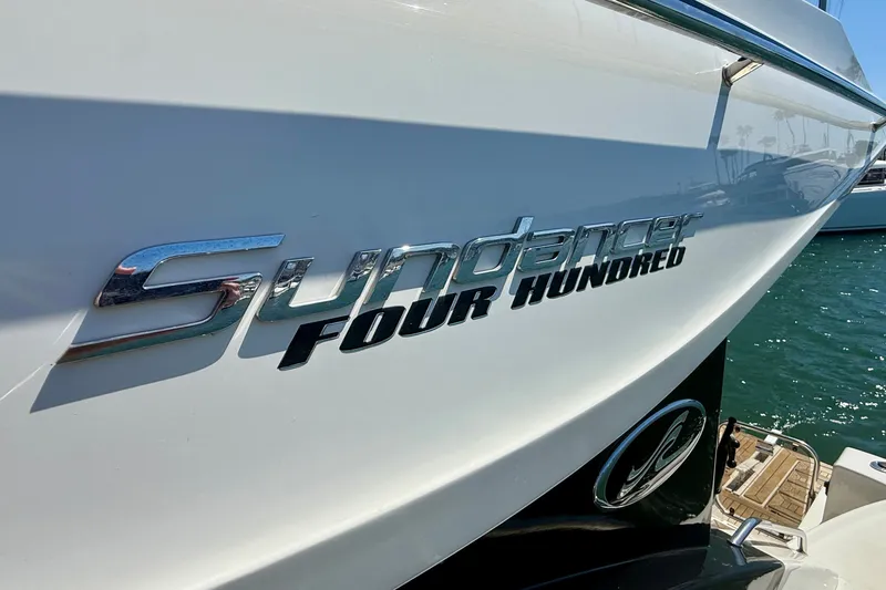 Slide: The Image of 2016 Sea Ray Sundancer 400 yacht, sleek design, docked on sunny waters. - 58