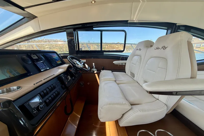 Slide: The Image of Interior of 2016 Sea Ray Sundancer 400 yacht with luxurious seating and modern dashboard. - 28