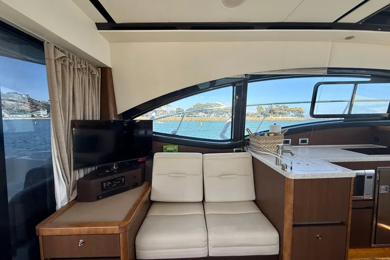 Slide: The Image of Interior of 2016 Sea Ray Sundancer 400 yacht with modern seating and ocean view. - 13