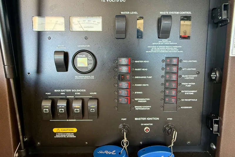 Slide: The Image of Control panel of a 2016 Sea Ray Sundancer 400 yacht, featuring switches and gauges. - 16