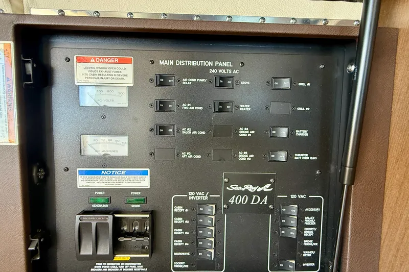 Slide: The Image of Electrical panel of 2016 Sea Ray Sundancer 400 boat, showing switches and gauges. - 17