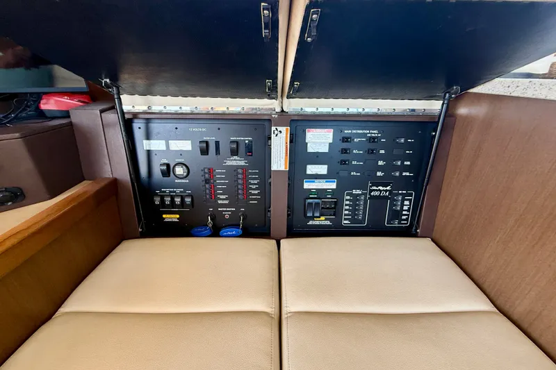 Slide: The Image of Electrical control panel of 2016 Sea Ray Sundancer 400 yacht, featuring switches and circuit breakers. - 15