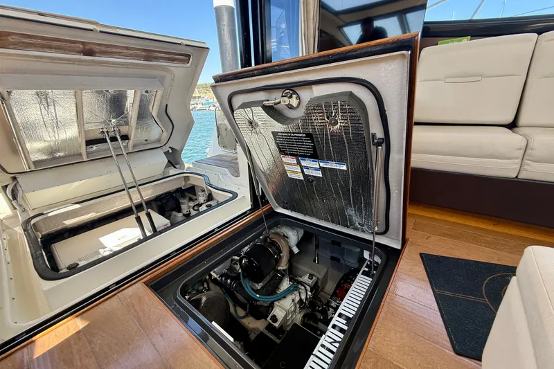 Slide: The Image of Engine compartment of 2016 Sea Ray Sundancer 400 yacht, showcasing interior details and components. - 63