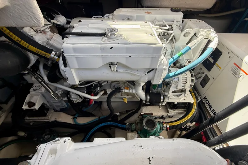 Slide: The Image of Engine room of a 2016 Sea Ray Sundancer 400 with visible Kohler generator. - 69